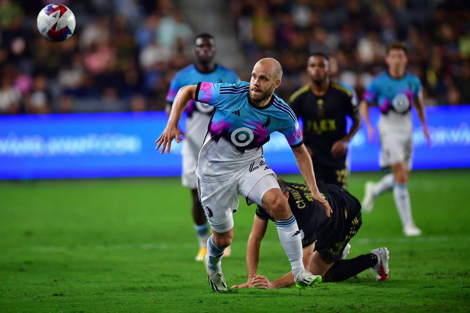 Oct 4, 2023; Los Angeles, California, USA; Minnesota United forward Teemu Pukki (22) plays for the ball against Los Angeles FC defender Giorgio Chiellini (14) during the first half at BMO Stadium.